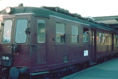 DSB MO 1849 heading for Vojens photographed at the railway station in Fredericia July 1975.  The MO class (type V) was built by Frichs in Denmark in a number of 90. It was put in service in 1951 - 1958. 3-B. Two 6-cyl. Frichs dieselelectric engines. 500 hp. Max speed 120 km/h - 75 mph. Length 20 930 mm. Weight 65 metric tonnes. 37 seats. MO 1849 was put in service in 1954. Withdrawn from service in 1983.